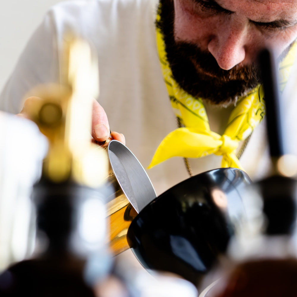 image of barista pouring milk into a cup