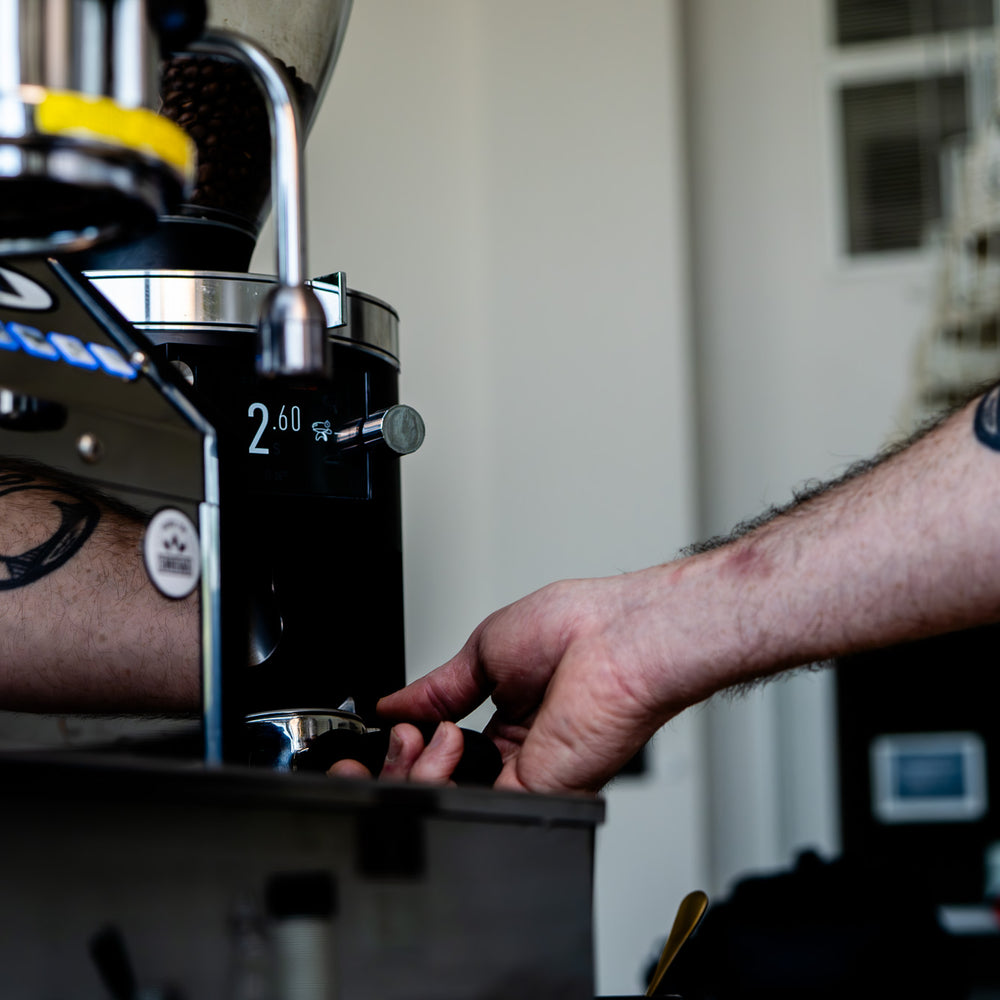 image of barista dialing in espresso 